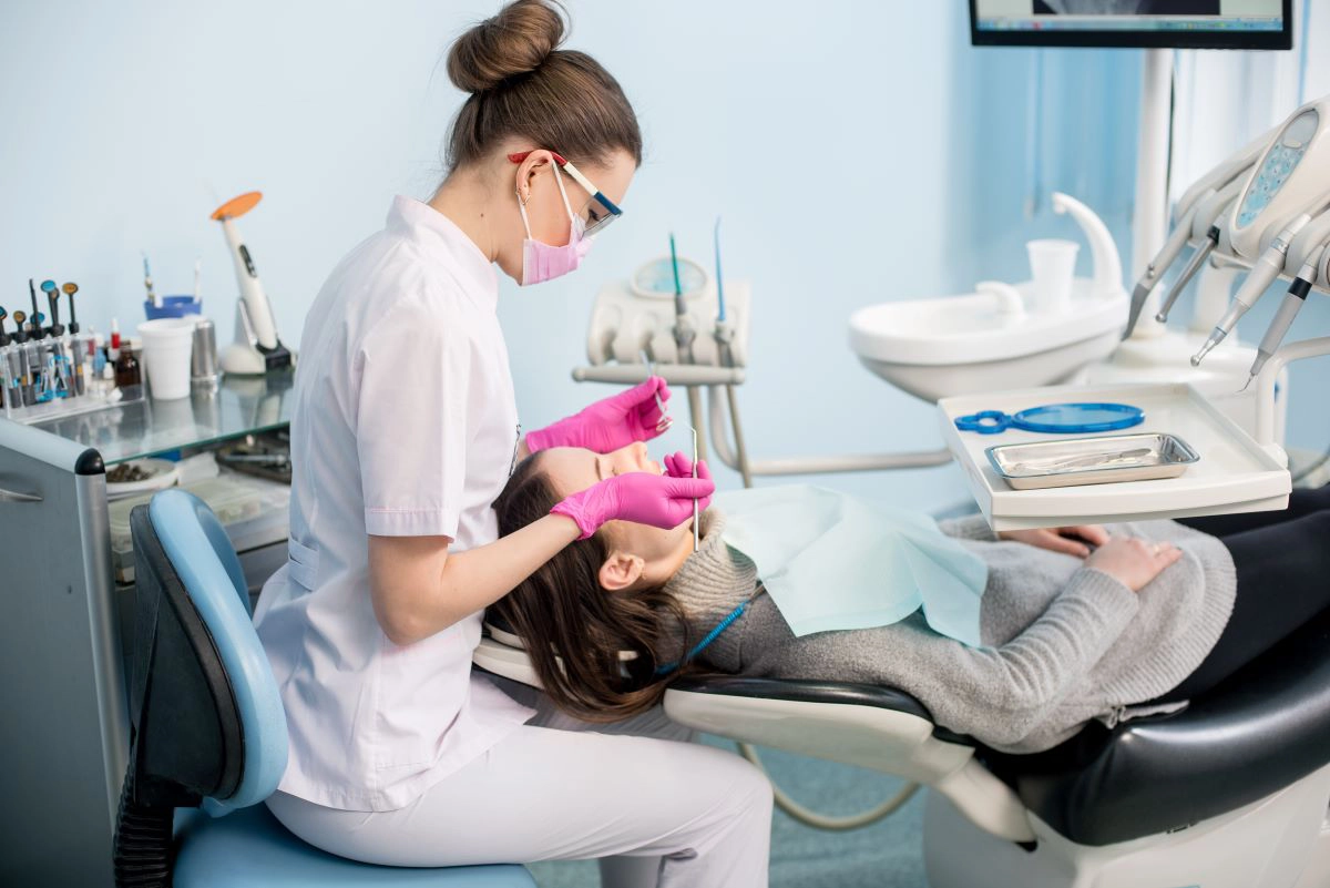 Patient receiving a routine dental examination