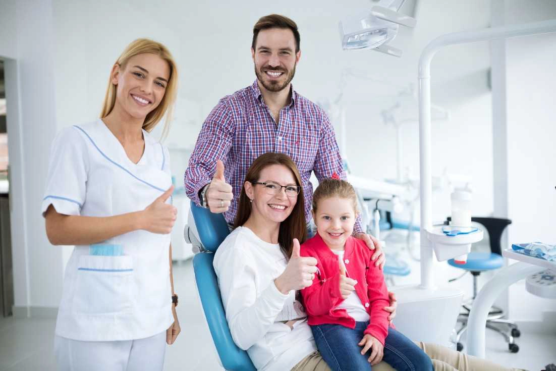 Family receiving welcoming dental care